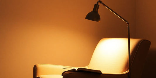 Cozy reading nook with stylish floor lamp.