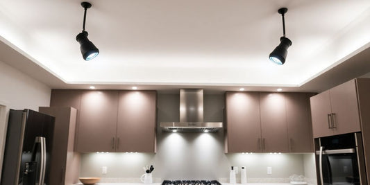 Modern kitchen spotlights illuminating a sleek countertop.